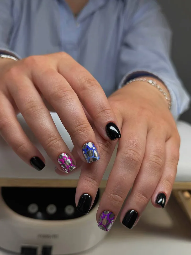 Short square black nails with chrome accent nails in pink, blue and purple