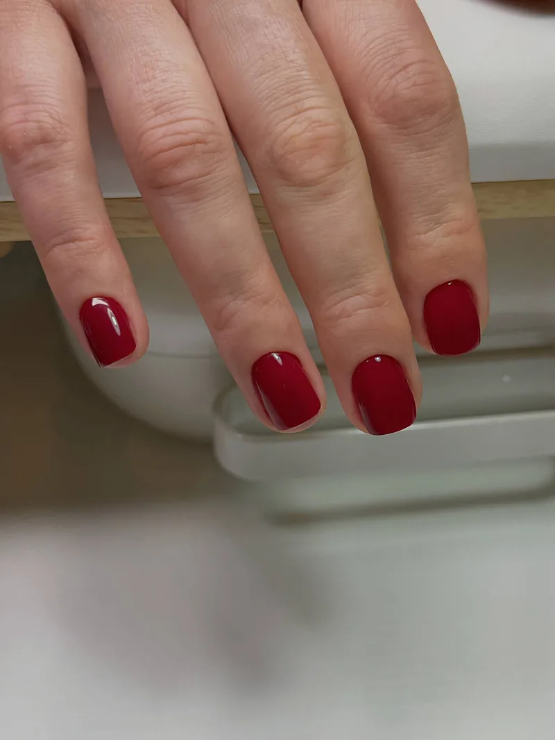 Short square nails in glossy cherry red gel